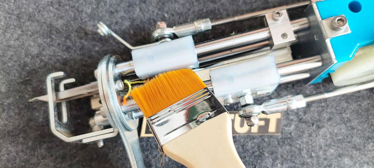 Brush away dust and fiber | Tufting Gun Maintenance